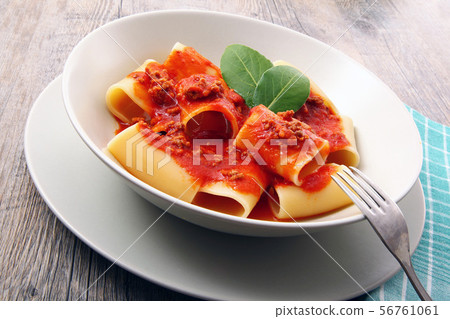 italian paccheri with meat sauce 56761061