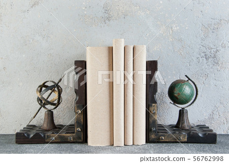 Antique book ends on a gray background Antique book ends on a gray background 56762998
