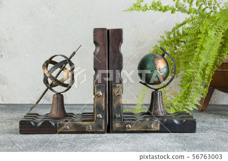 Antique book ends on gray background Antique book ends on gray background 56763003