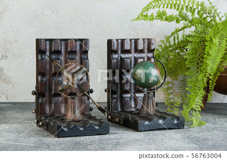Antique book ends on gray background Antique book ends on gray background 56763004