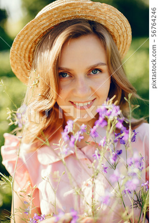 Elegant and stylish girl in a summer field 56764246