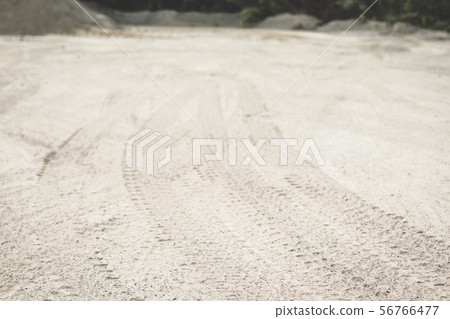 Texture traces of tractor tires on the ground 56766477