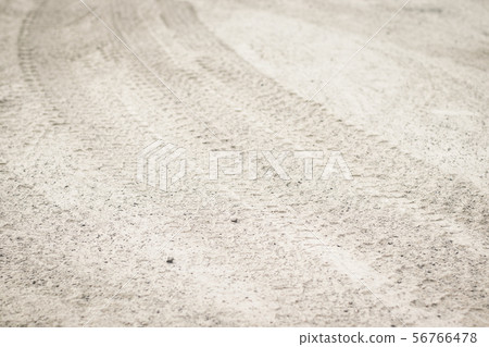 Tire tread footprints of a tractor on the sand. 56766478