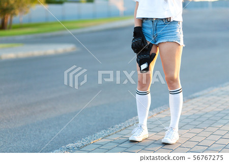 Closeup girl hold special gloves for skateboard 56767275
