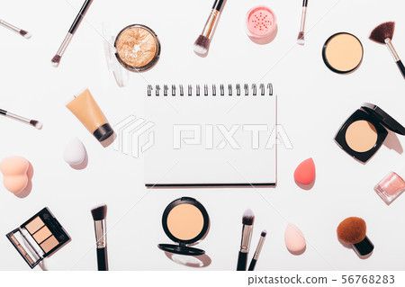 Flat layout of blank notepad among decorative Flat layout of blank notepad among decorative 56768283
