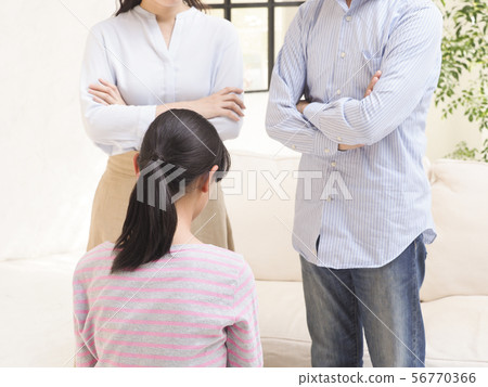 A husband and wife apologizing to a child A husband and wife apologizing to a child 56770366