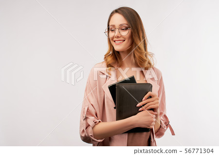 Positive business woman with confident smile. Positive business woman with confident smile. 56771304