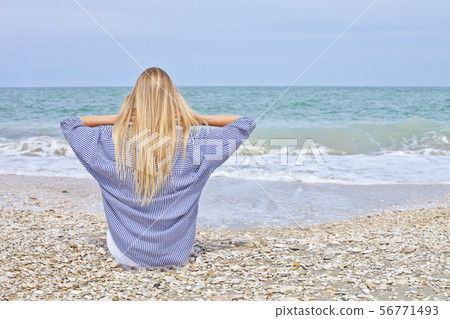 Beautiful girl in sea style on the Adriatic beach. Beautiful girl in sea style on the Adriatic beach. 56771493