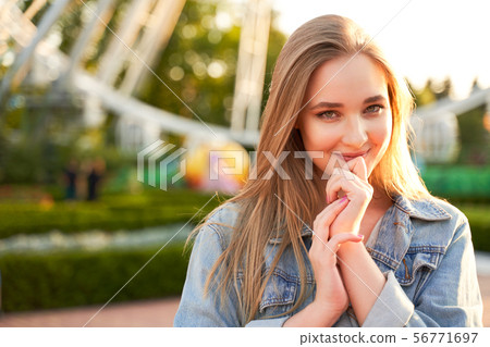 Young woman with romantic look and tender smile. Young woman with romantic look and tender smile. 56771697