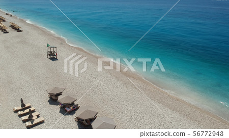 Rocky beach and crystal turquoise water of Ionian Sea in Albania. Rocky beach and crystal turquoise water of Ionian Sea in Albania. 56772948