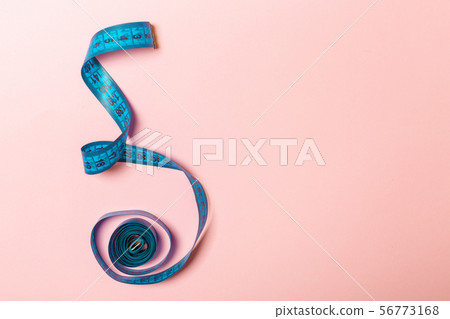 Tangled measuring tape with space for your idea. 56773168