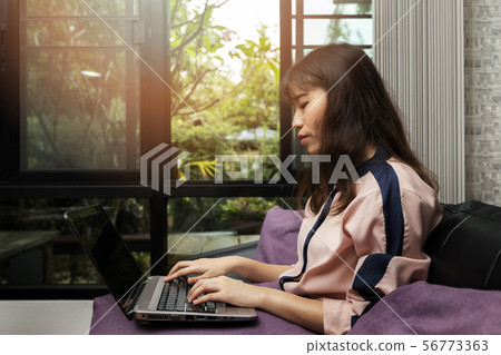 Closeup of businesswoman hands on laptop at office Closeup of businesswoman hands on laptop at office 56773363