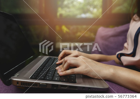 Closeup of businesswoman hands on laptop at office Closeup of businesswoman hands on laptop at office 56773364