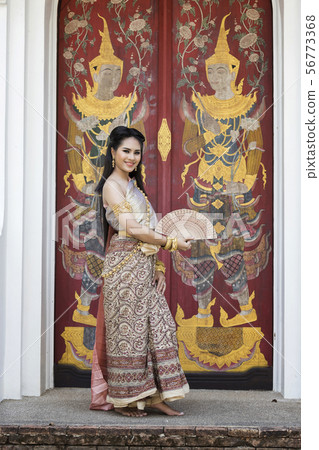 Thai woman wearing thai traditional clothing. Thai woman wearing thai traditional clothing. 56773368