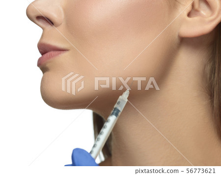 Portrait of beautiful young woman isolated on white studio background 56773621