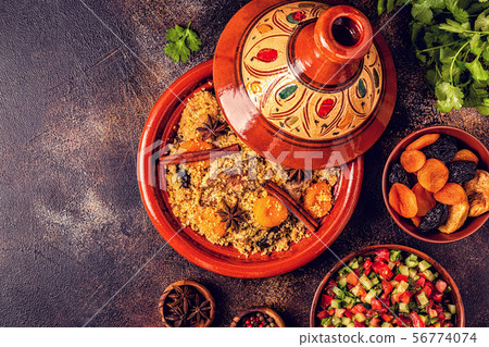 Traditional moroccan tajine of chicken with dried 56774074