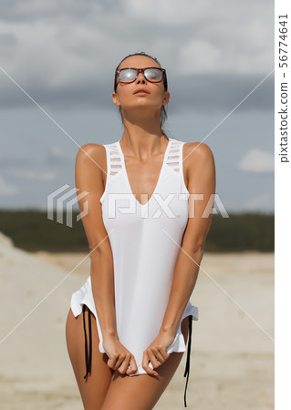 Pretty female in beachwear on nature background 56774641