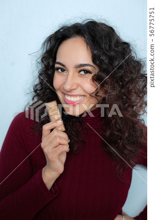 Girl eats a chocolate and shows emotions Girl eats a chocolate and shows emotions 56775751