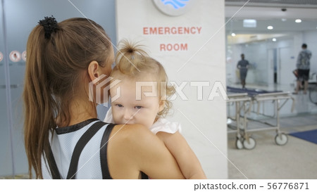 Mom and child come in in the emergency room at the hospital in Pattaya Thailand. 56776871