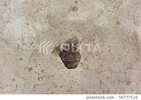 Cracks holes on the cement wall Caused by drilling To put the plumbing tube in the house. Cracks holes on the cement wall Caused by drilling To put the plumbing tube in the house. 56777528