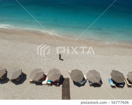 Rocky beach and crystal turquoise water of Ionian Sea in Albania. 56777606