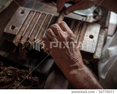 Cigar rolling or making by torcedor in cuba 56778057