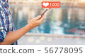 Male hand holds a smart phone. 56778095