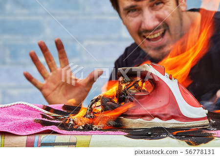 A man sees his  iron for clothes ironing is 56778131
