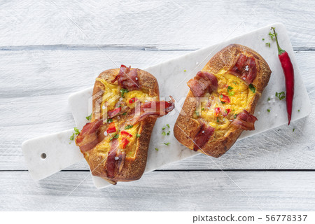 Omelet and bacon in bread. Breakfast for two 56778337