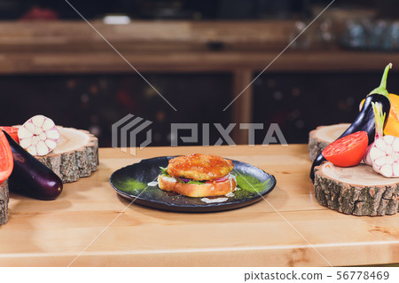 Chef making healthy vegetarian salmon burgers outdoor on open kitchen, odprta kuhna, international Chef making healthy vegetarian salmon burgers outdoor on open kitchen, odprta kuhna, international 56778469