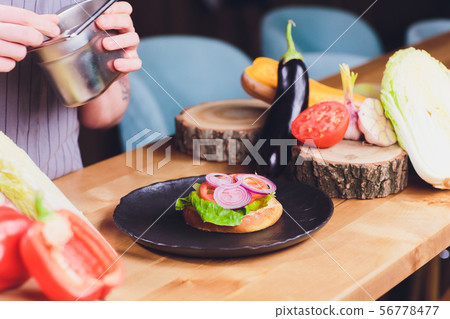 Chef making healthy vegetarian salmon burgers outdoor on open kitchen, odprta kuhna, international Chef making healthy vegetarian salmon burgers outdoor on open kitchen, odprta kuhna, international 56778477