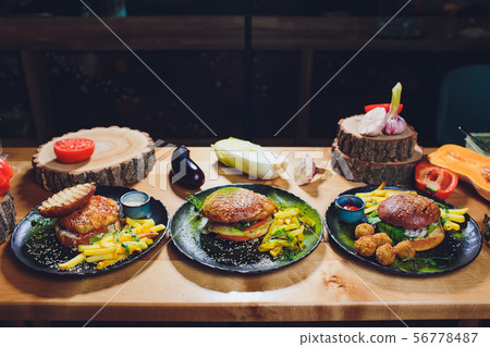 Red, green,black mini burgers with quinoa and vegetables. Red, green,black mini burgers with quinoa and vegetables. 56778487