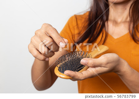 young asian woman worried about hair loss on a 56783799
