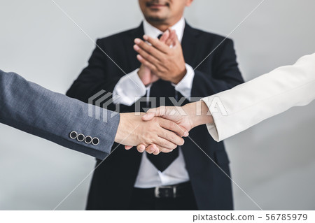 Business man and woman handshake Business man and woman handshake 56785979