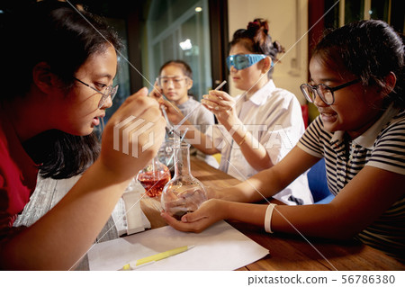 asian teacher and student in school   science 56786380