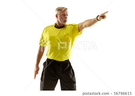 Football referee gives directions with gestures to players isolated on white background Football referee gives directions with gestures to players isolated on white background 56786615