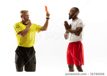 Football referee showing a red card to a displeased player isolated on white background Football referee showing a red card to a displeased player isolated on white background 56786806