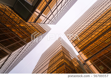 Low angle view of gold modern business skyscraper Low angle view of gold modern business skyscraper 56789357