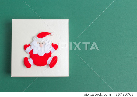 Small Santa Claus on a Christmas Day Gift Box Small Santa Claus on a Christmas Day Gift Box 56789765