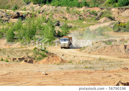 Dump truck transporting sand in mining quarry 56790196