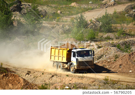 Dump truck transporting sand in mining quarry Dump truck transporting sand in mining quarry 56790205