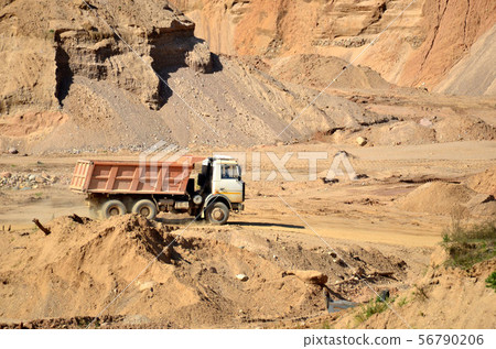 Dump truck transporting sand in mining quarry 56790206