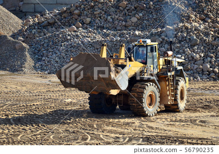 Large heavy front-end loader in quarry Large heavy front-end loader in quarry 56790235