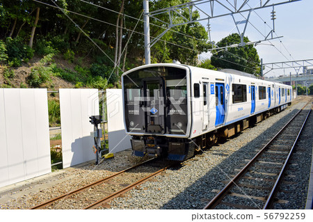 Storage battery train Kumoha BEC819 series waiting at JR Kashii Station Storage battery train Kumoha BEC819 series waiting at JR Kashii Station 56792259