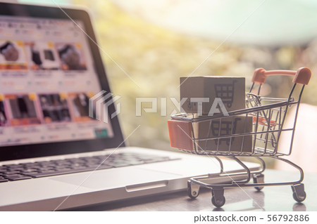 Shopping online concept - Parcel or Paper cartons Shopping online concept - Parcel or Paper cartons 56792886