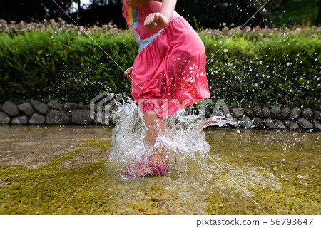 Children playing with water 56793647