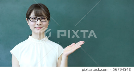 Image of female teacher with blackboard Image of female teacher with blackboard 56794548