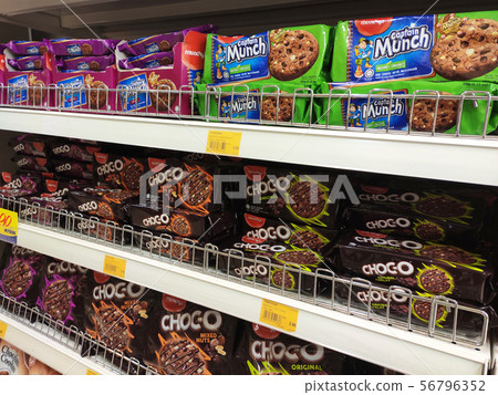 Variety of biscuits for sale in supermarket.  56796352