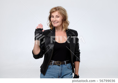 Elderly caucasian woman in black leather jacket. Elderly caucasian woman in black leather jacket. 56799036
