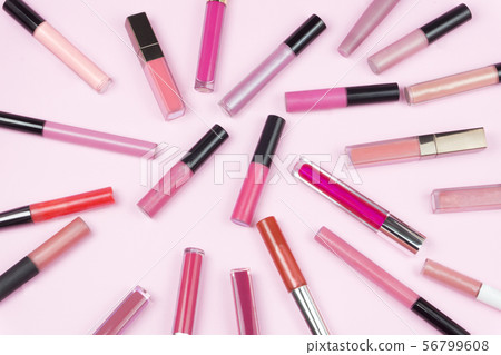 Shocking pink rose with lots of colorful lip gloss Shocking pink rose with lots of colorful lip gloss 56799608